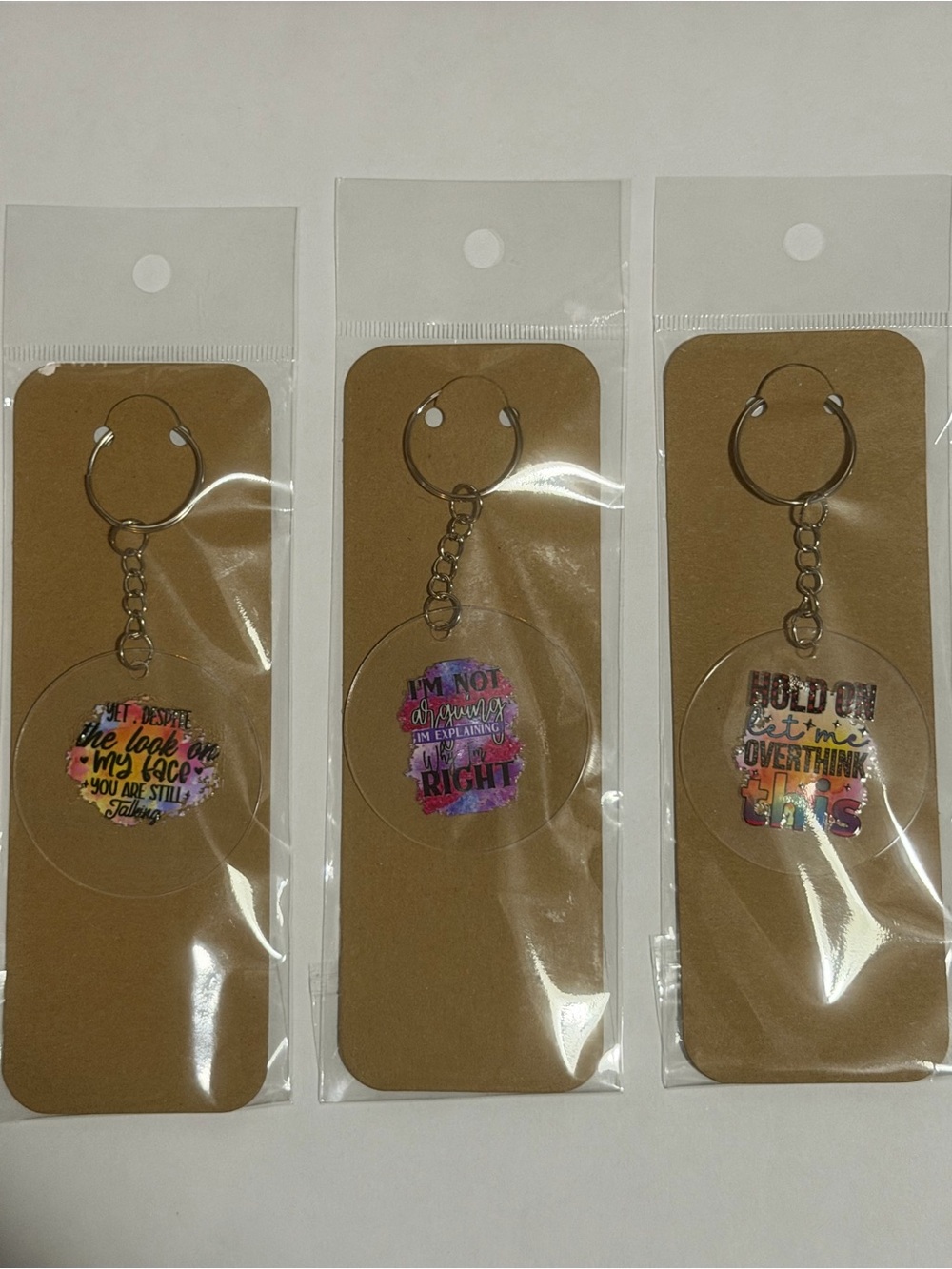 Acrylic Round Keychain with Colorful Quote Design - Multicolor